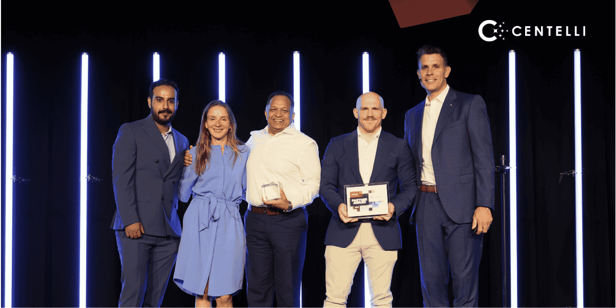 Centelli team with 2026 UiPath Impact Partner Plaque at Las Vegas event stage